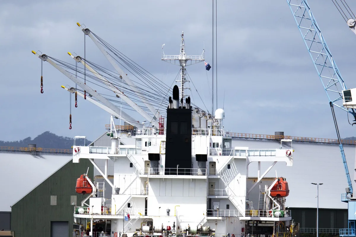 Container ship at port with export cargo for US import